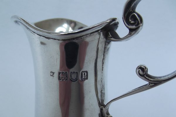 Hallmark on silver cream jug