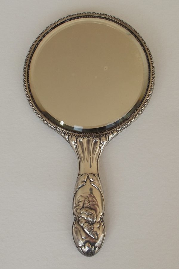 Face of silver hand mirror