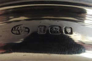 Closeup of hallmarks on silver pin tray