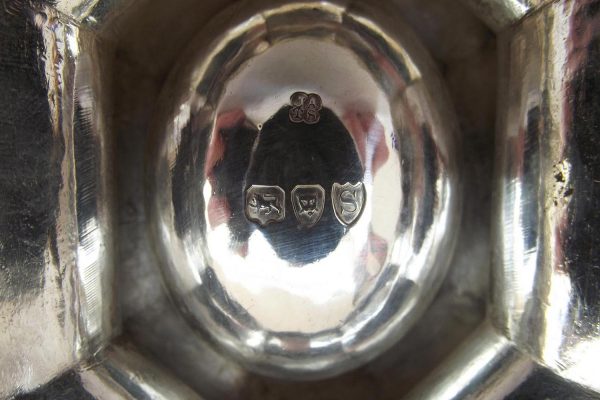 Closeup of hallmarks on silver trencher salts